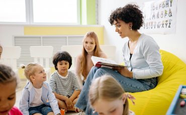 Teacher managing classroom behavior with storytime